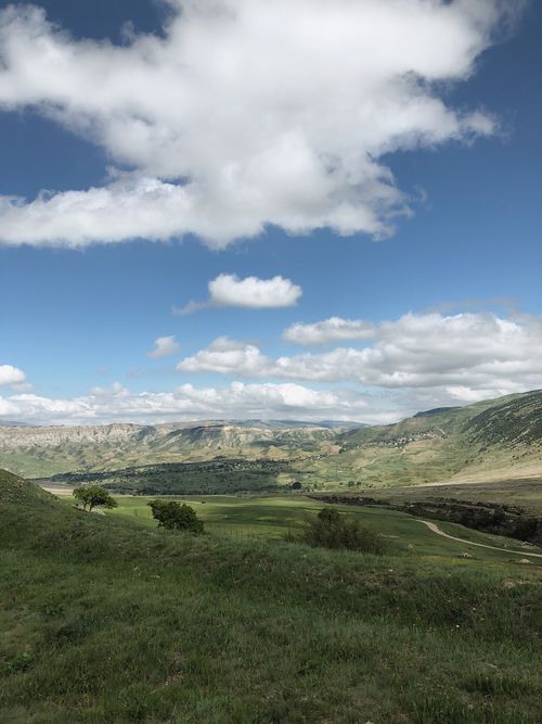 Free Breathtaking view of the mountainous landscape in Keger, Dagestan under a clear blue sky with clouds. Stock Photo