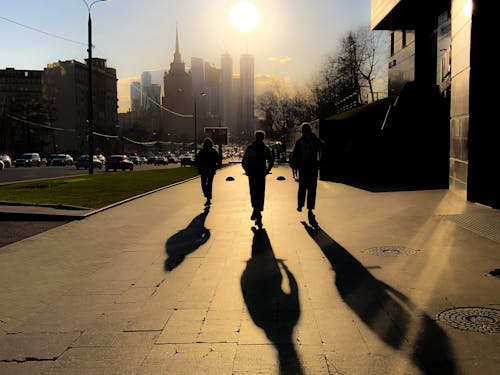 Silhouette of People Walking on Sidewalk