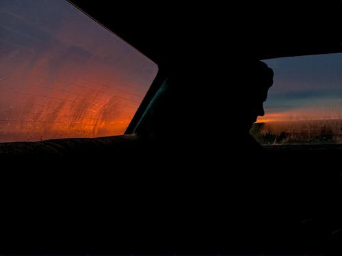 Silhouette of Person Inside a Vehicle
