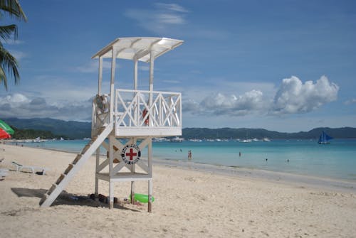 White Wooden Lifeguard Tower on Beach