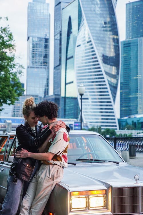 Couple Leaning on a Car