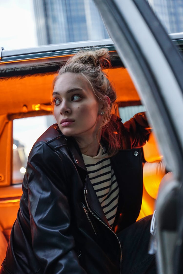 Beautiful Woman In Black Leather Jacket Going Inside The Car