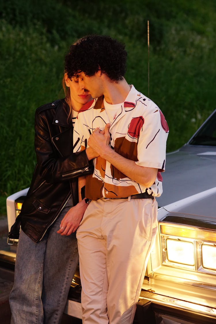 Photo Of Couple Leaning On A Car