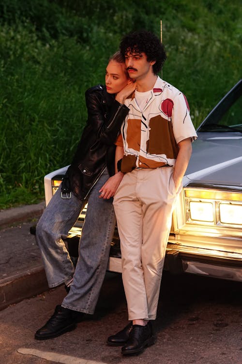 Man and Woman Leaning on a Car