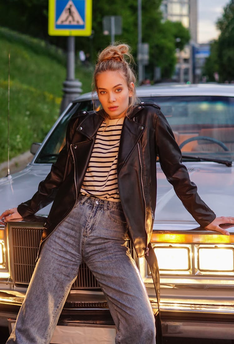 Woman In Black Leather Jacket Leaning On A Car