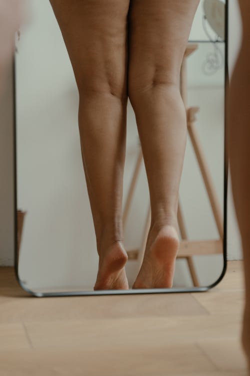 Free Photo of a Woman's Legs on a Mirror Stock Photo