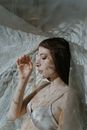 Alluring Woman under a Sheer Textile