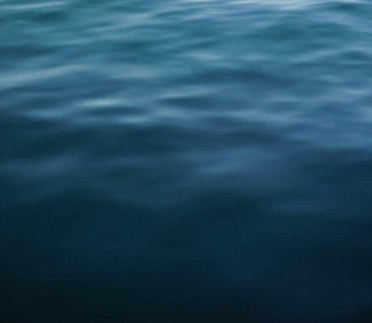 Serene view of ocean surface with gentle waves creating a calming effect, perfect for background or wallpaper.