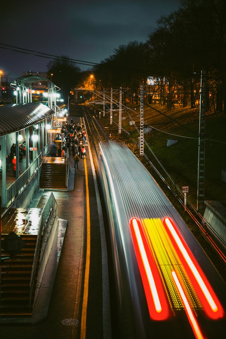 People At Train Station At Night