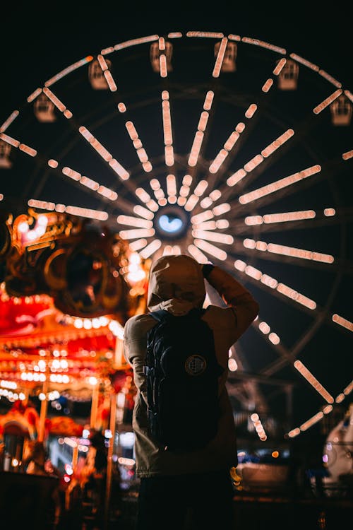 Man in an Amusement Park at Night 
