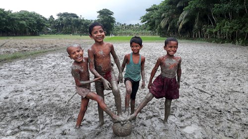 kids playing in the mud