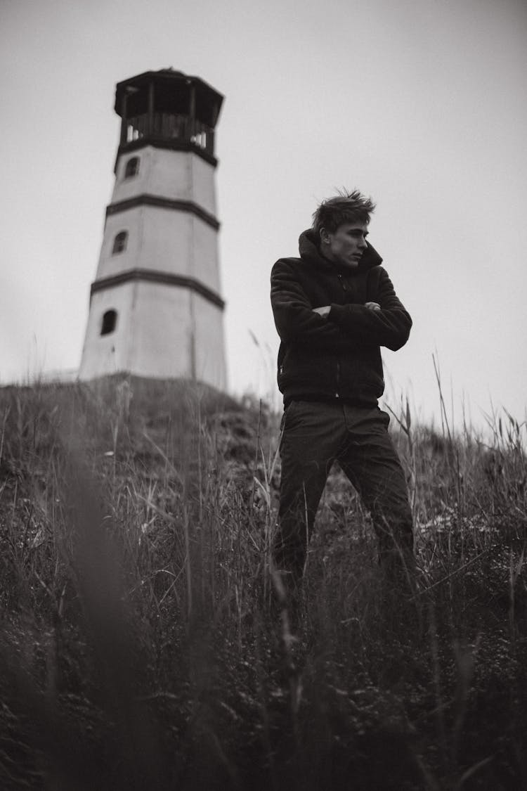 Man Standing Near Lighthouse