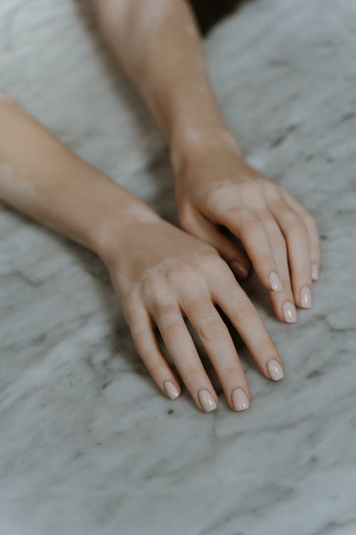 Free Close-Up of Hands on a Marble Surface Stock Photo