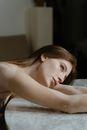 Woman Resting her Head on Table Top