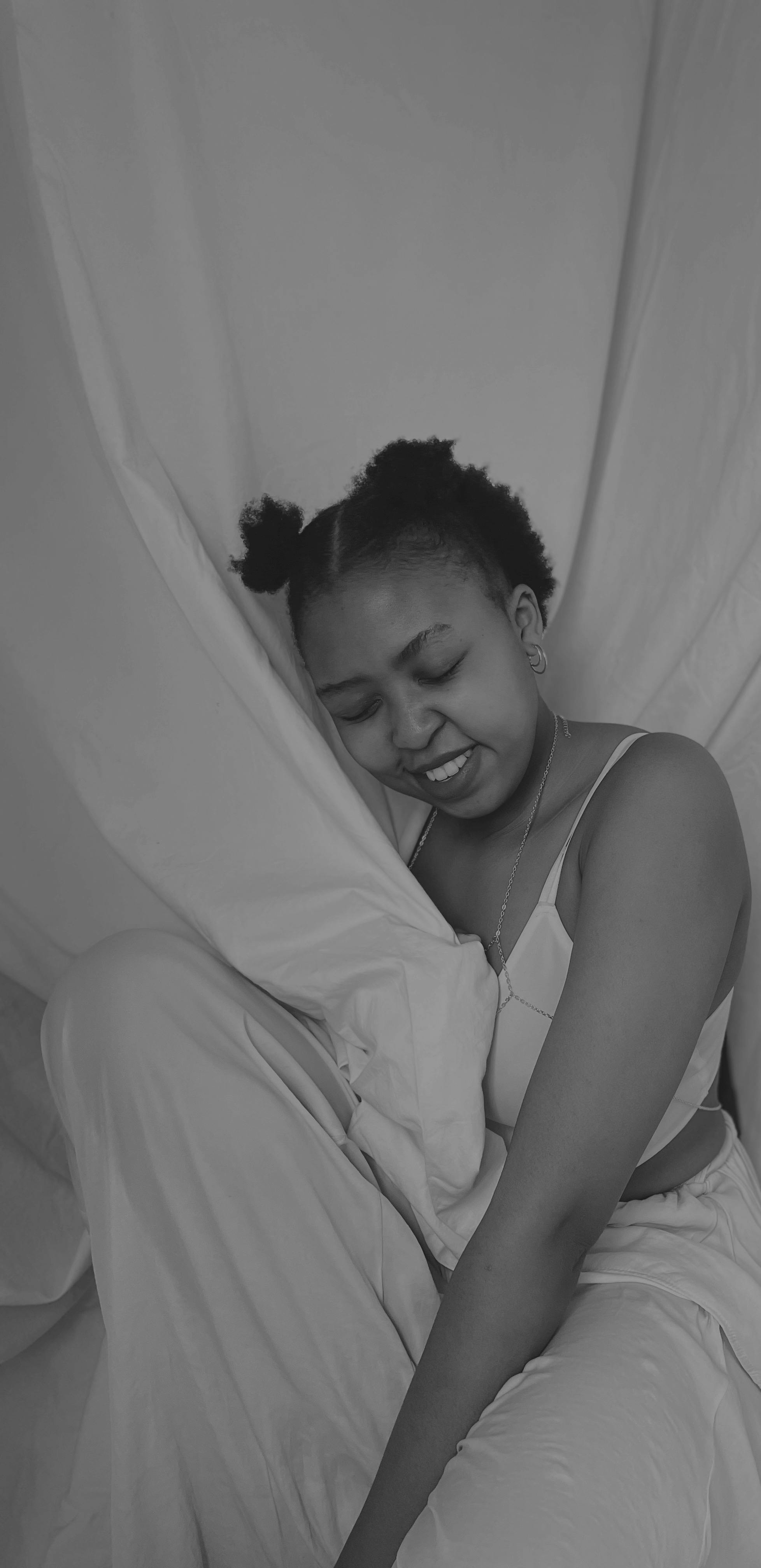 smiling girl in pajama posing in studio