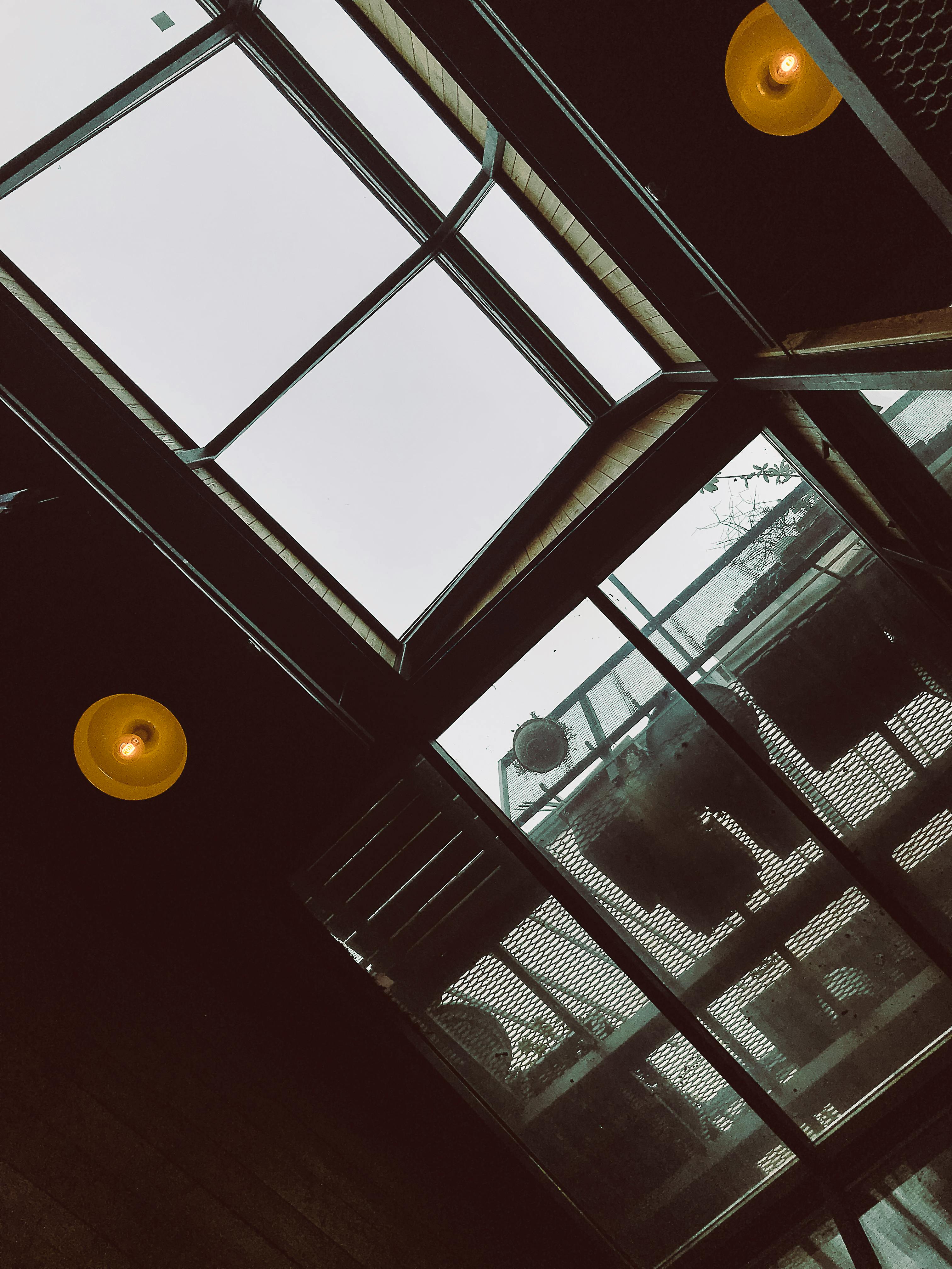 A striking view of modern urban skylights and ceiling architecture in a Moscow building.