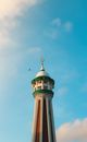 White and Green Tower Under Blue Sky