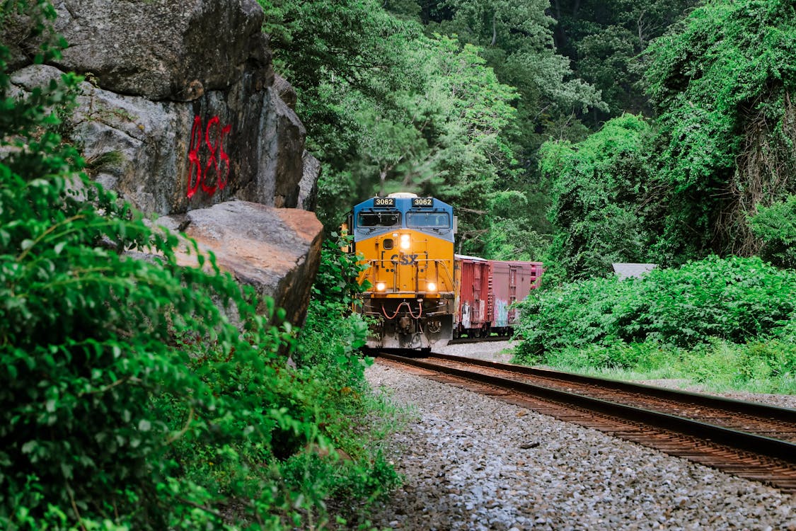 A Yellow Train on the Railroad Track