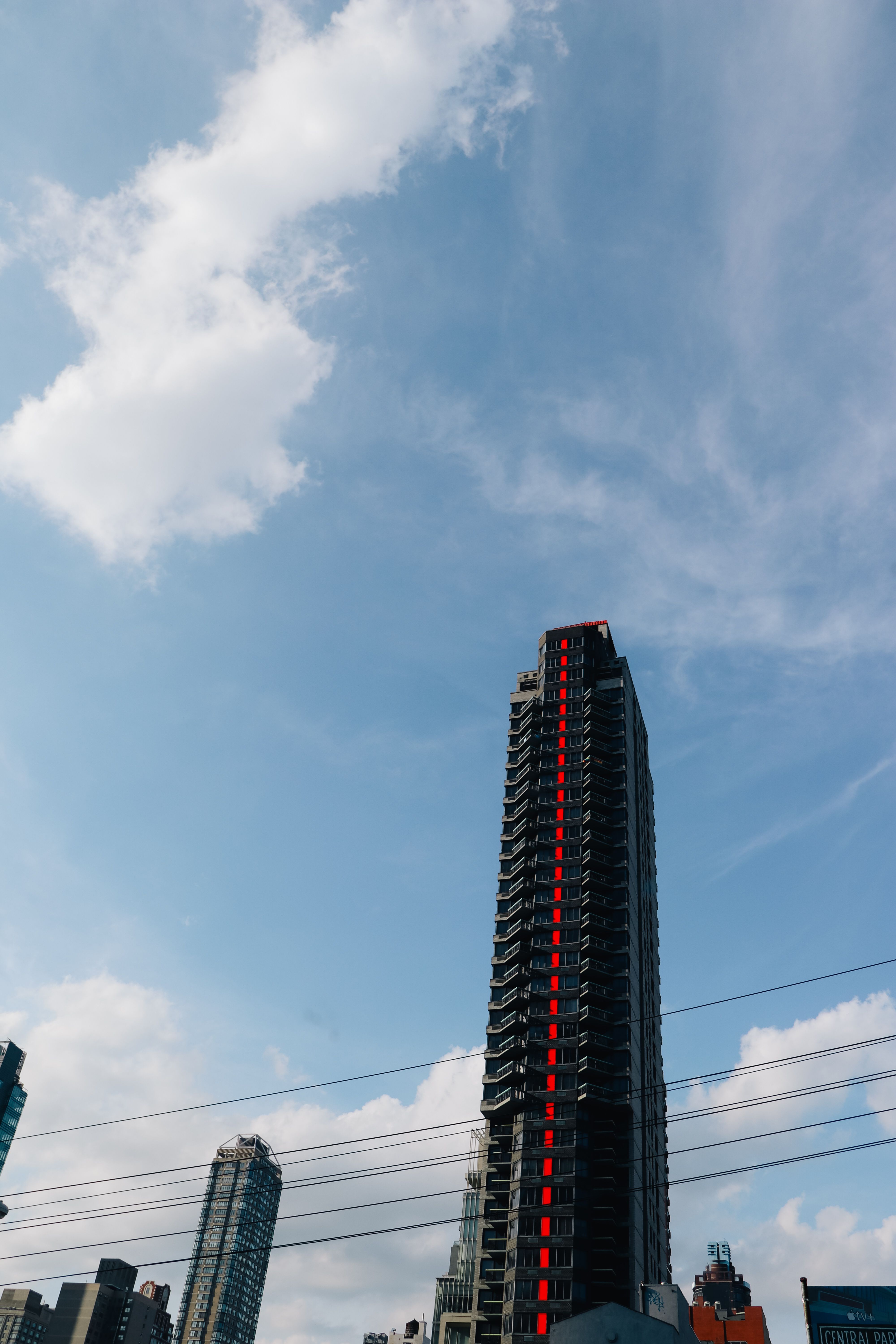Low-Angle Shot of a Skyscraper Under Blue Sky · Free Stock Photo