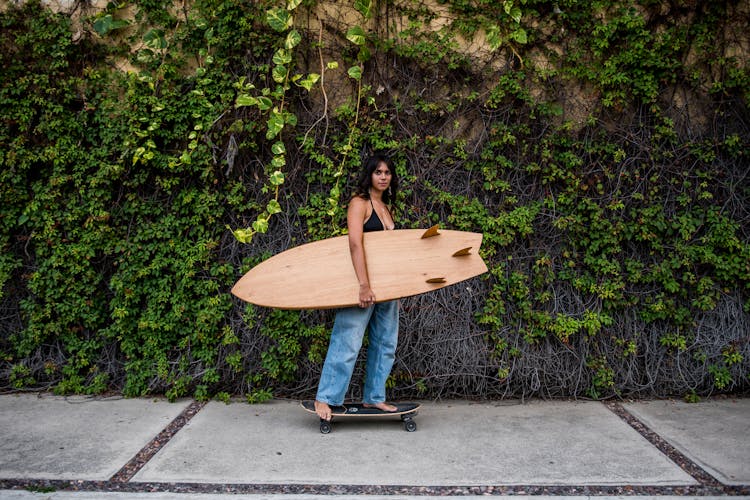 Woman Carrying Surf Board