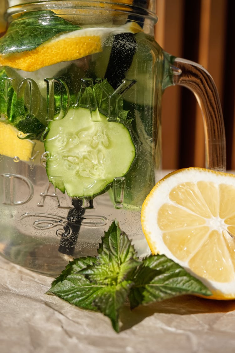 Slices Of Lemon And Cucumber In Pitcher