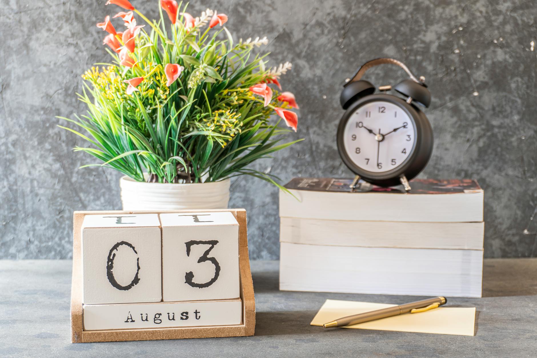 Yellow and Red Flowers on White Wooden Table