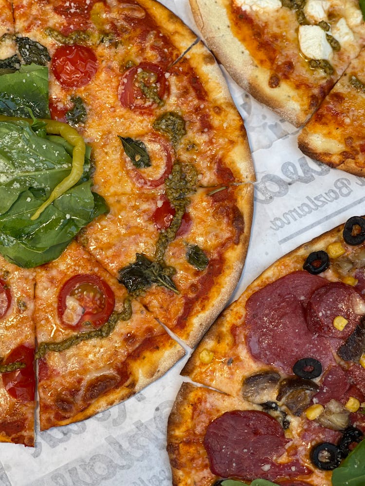 Overhead Shot Of Pizzas With Cheese