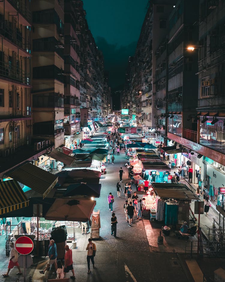 People Walking On Night Market