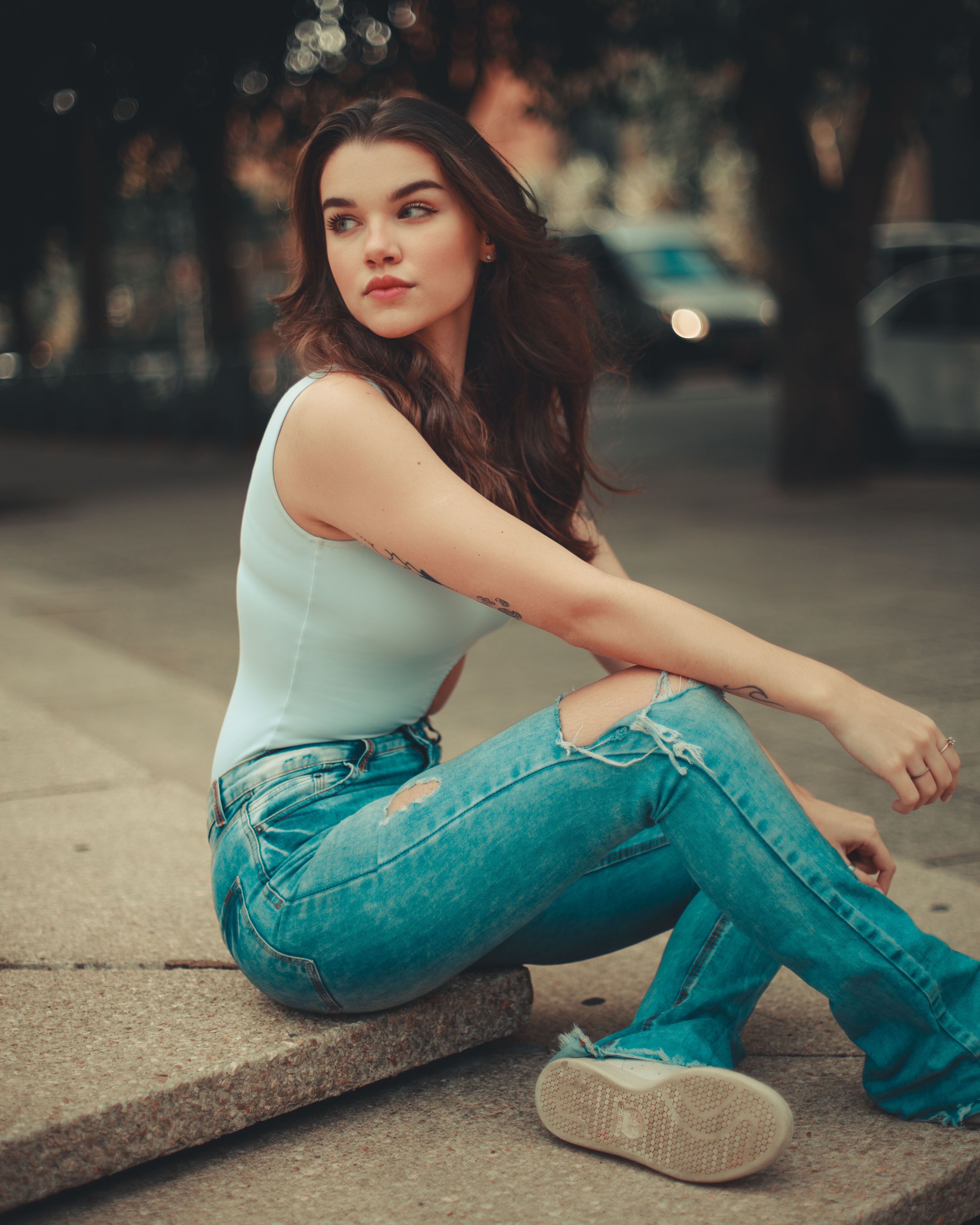 A Woman Sitting on the Concrete · Free Stock Photo
