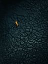 Aerial Shot of a Person Lying on a Barren Land