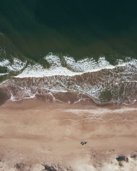 Stunning aerial view of the beach at Punta del Este in Uruguay, capturing the ocean waves and serene coastline.