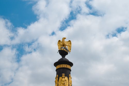 Free Gold Statue Under White Clouds Stock Photo