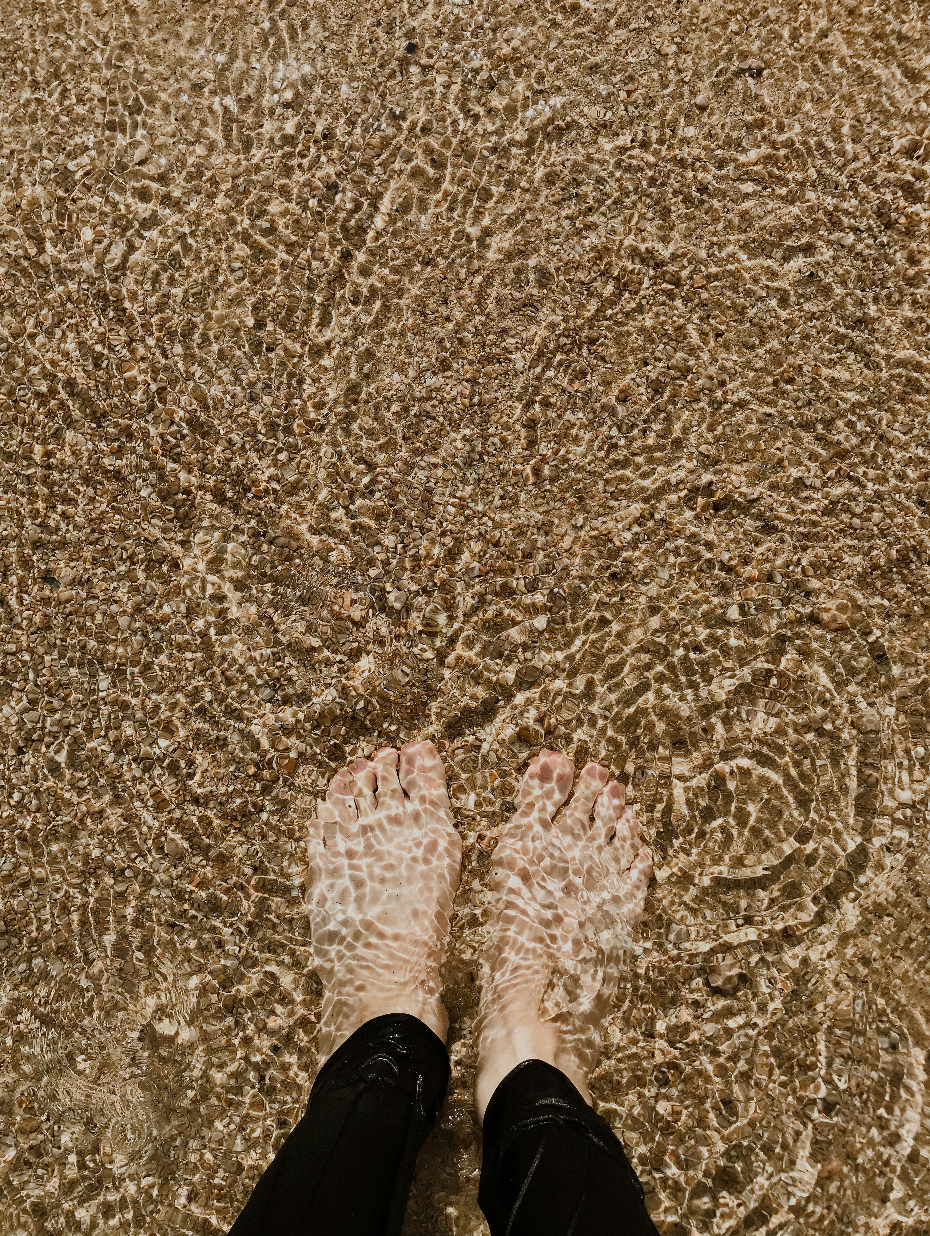 crop person standing in water