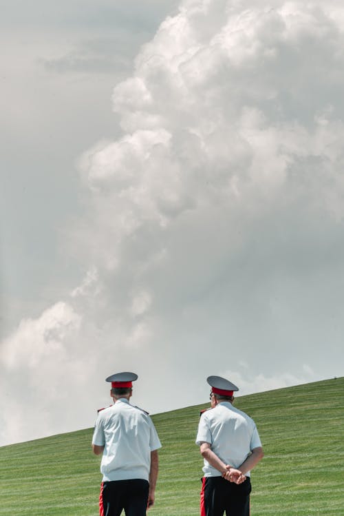 Men in Uniform and Hat Standing Side by Side
