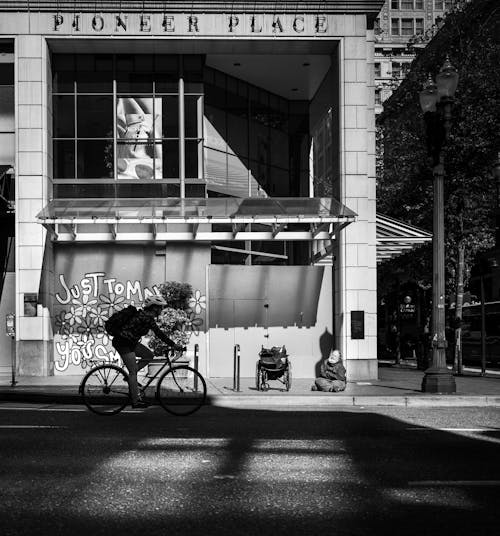 
A Grayscale of a Cyclist on the Road