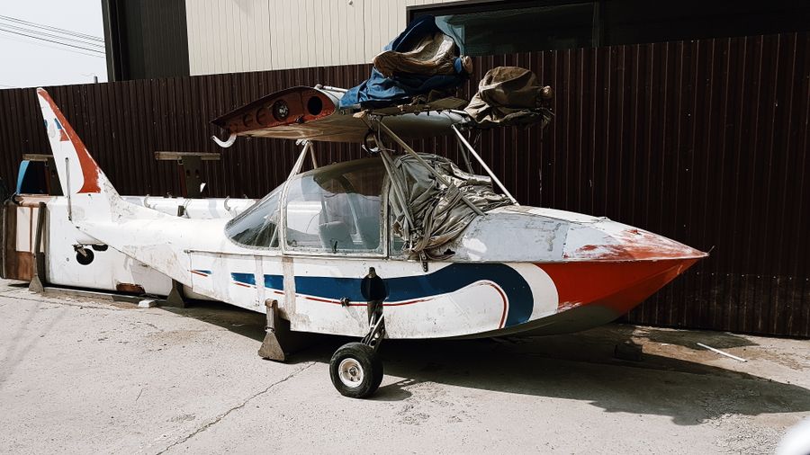 Aircraft standing inside a spacious maintenance hangar
