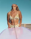 Woman in White Bikini Standing on Pink Inflatable Ring