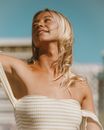 Woman in White Off Shoulder Top