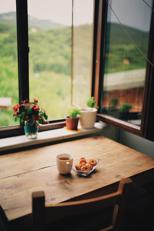 A Wooden Table Near the Window with a View