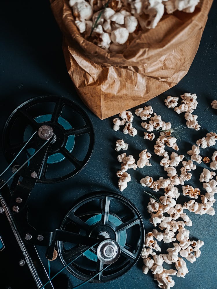 Popcorn In Paper Bag On Film Reel