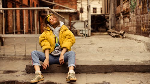 Portrait of a Woman Sitting in a City