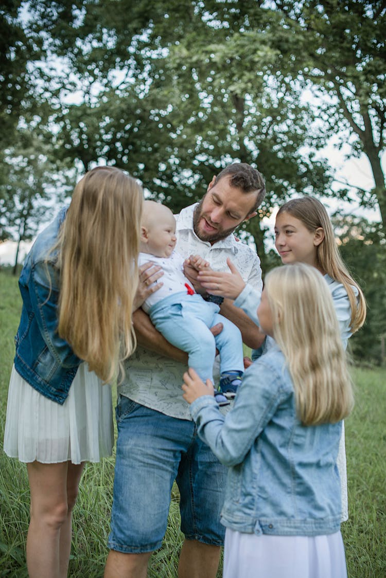 Happy Family With Newborn Child