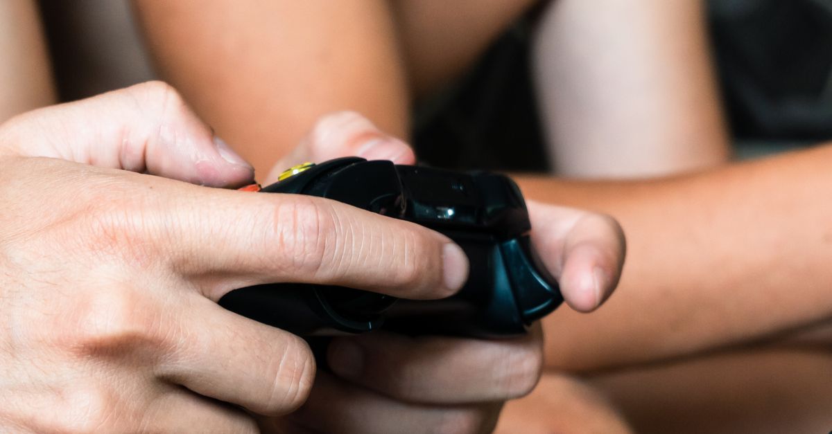 Person Using Game Controller A Person Holding a Game Controller · Free Stock Photo