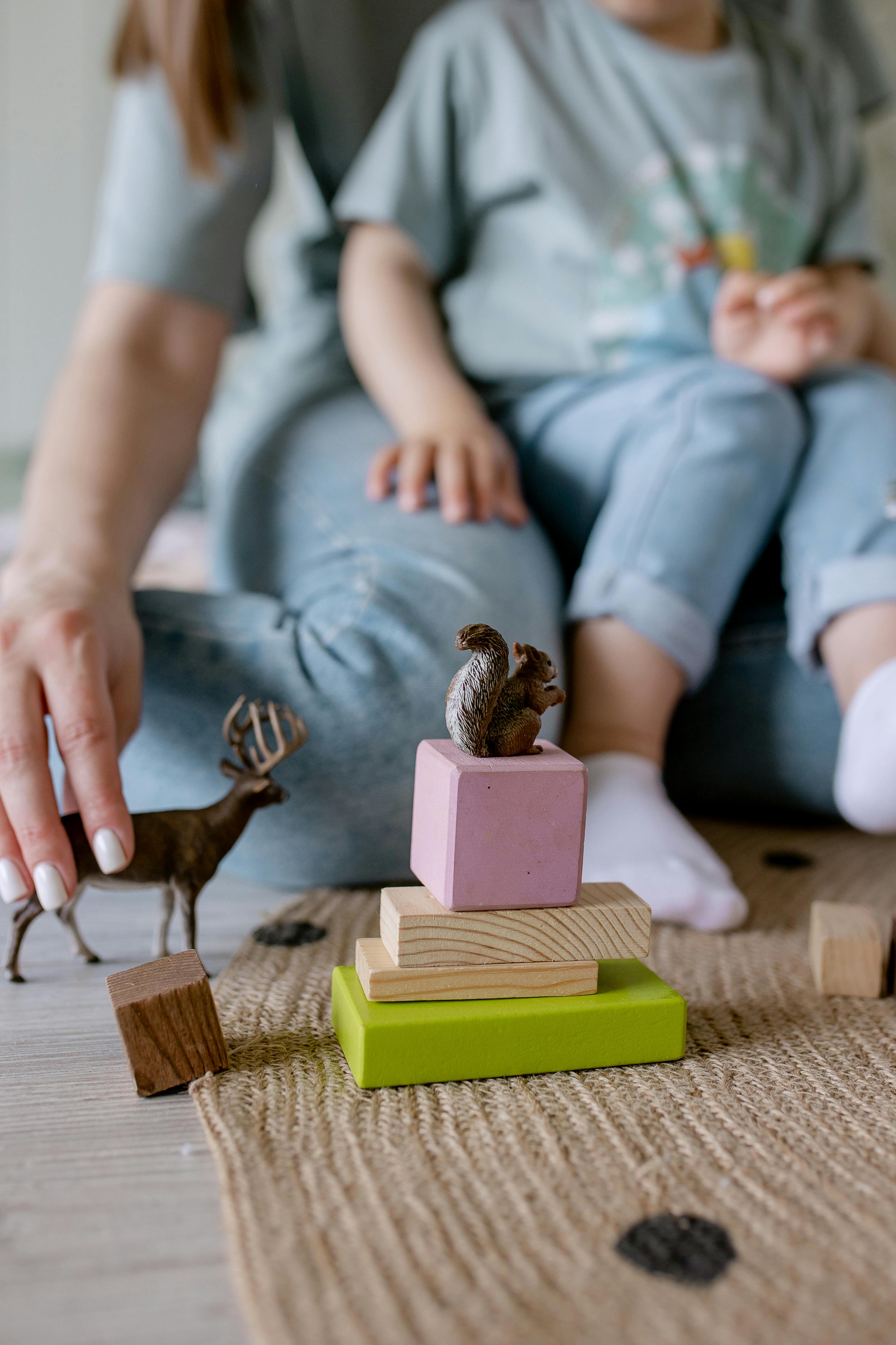 a person holding wooden toys