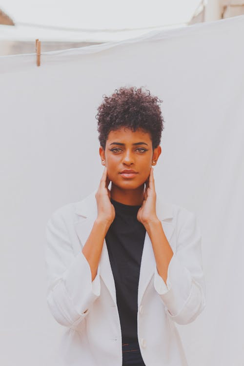 A Pretty Afro-Haired Woman in White Blazer 