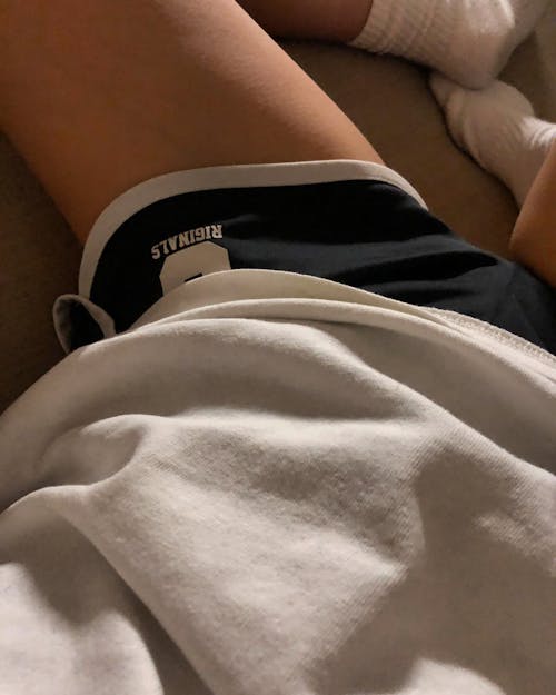 Photo of a Person Wearing Black and White Shorts