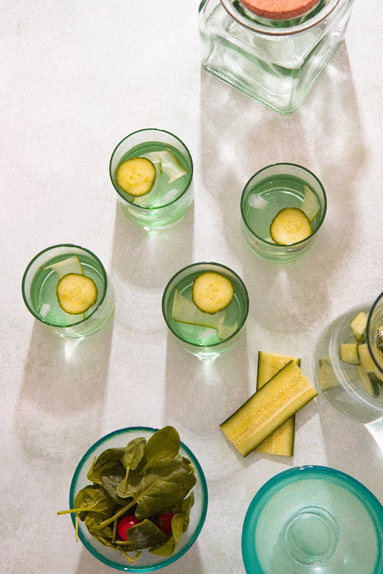 Overhead Shot Of Glasses With Cucumber Slices