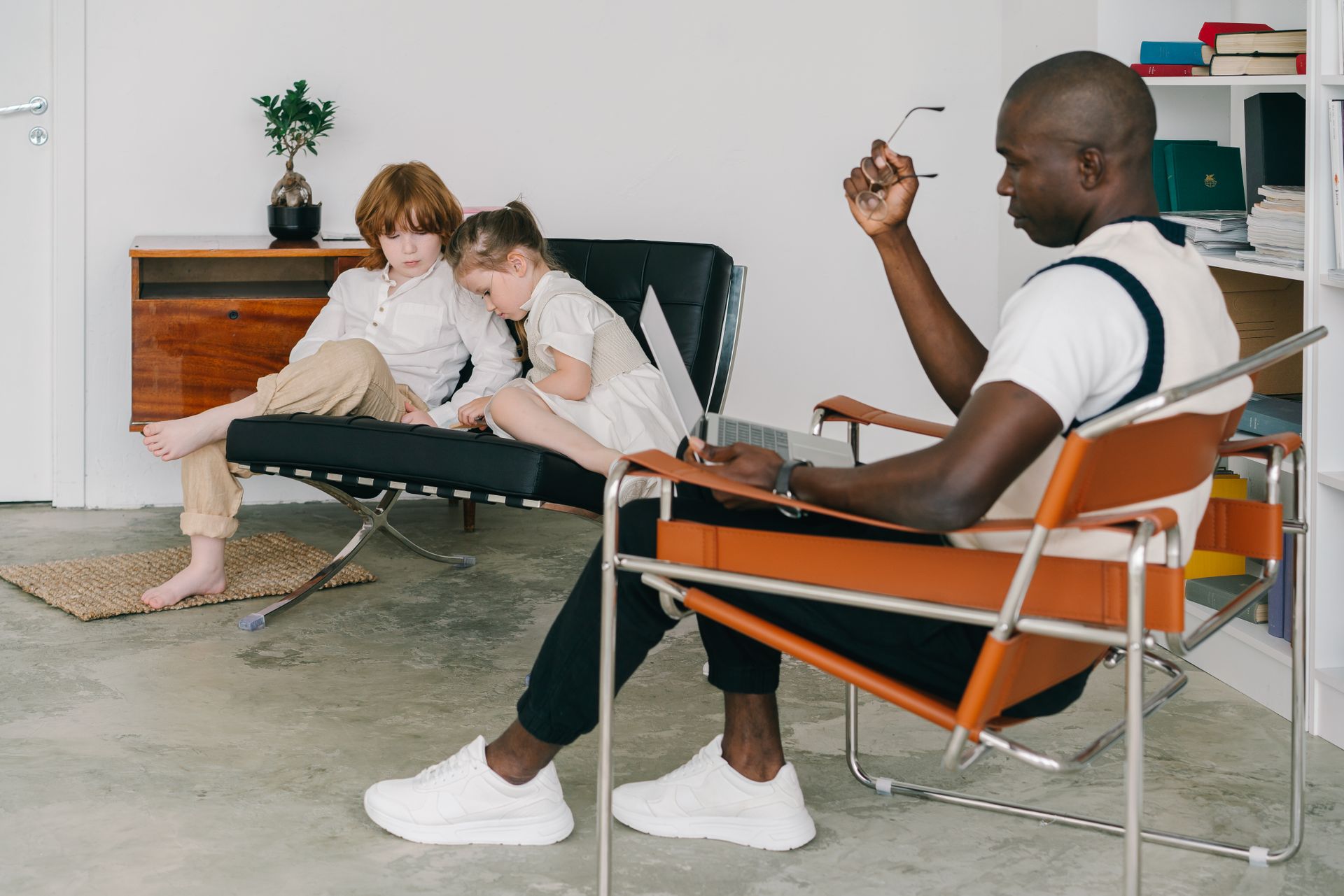 Two Kids Sitting on the Chairs