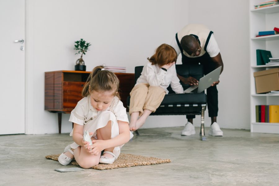Child engaged in playful activity with supportive adult