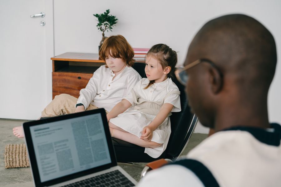 Therapist supporting children during a therapy session